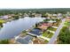 Waterfront homes with private docks and access to the tranquil canal, complemented by lush landscaping and serene surroundings at 474 Lomond Dr, Port Charlotte, FL 33953