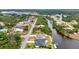 An aerial photograph reveals homes along the canal, complete with boat docks and lush palm trees at 474 Lomond Dr, Port Charlotte, FL 33953