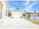 Backyard features a small shed, river access, and white rock landscaping at 474 Lomond Dr, Port Charlotte, FL 33953