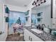 Bright bathroom featuring granite counters, a decorative mirror, and a unique 'get naked' themed shower curtain at 474 Lomond Dr, Port Charlotte, FL 33953