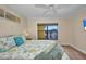 Cozy bedroom featuring a ceiling fan, neutral carpet, and a window view to the outdoors at 474 Lomond Dr, Port Charlotte, FL 33953