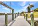 The home has a private boat dock with a boat lift for easy access to the water at 474 Lomond Dr, Port Charlotte, FL 33953