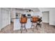 Bright kitchen area with bar seating and modern appliances, perfect for entertaining at 474 Lomond Dr, Port Charlotte, FL 33953