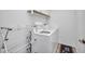 Bright laundry room with washer, dryer, and storage shelf at 474 Lomond Dr, Port Charlotte, FL 33953
