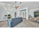 Open living room with neutral tones, tile floors, and ceiling fan at 474 Lomond Dr, Port Charlotte, FL 33953