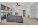 Open-concept living room with views of the pool, comfortable seating, and modern decor at 474 Lomond Dr, Port Charlotte, FL 33953