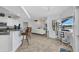 Open-concept living space featuring a seamless flow to the kitchen and outdoor bar area at 474 Lomond Dr, Port Charlotte, FL 33953