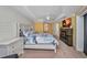 Spacious bedroom boasts a king bed, ceiling fan, fireplace, sliding glass doors, and modern decor at 474 Lomond Dr, Port Charlotte, FL 33953