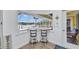 Outdoor bar area overlooking the pool and waterway at 474 Lomond Dr, Port Charlotte, FL 33953