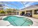 Spacious screened-in pool and covered lanai for relaxing and entertaining at 474 Lomond Dr, Port Charlotte, FL 33953