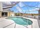Breathtaking view of screened in pool and waterfront featuring newer enclosure at 474 Lomond Dr, Port Charlotte, FL 33953