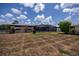 Large backyard featuring a screened-in pool and ample green space at 543 Mayview Nw Ave, Port Charlotte, FL 33952