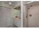 Well-lit bathroom with a walk-in shower, ample storage, and a sink, perfect for comfortable living at 543 Mayview Nw Ave, Port Charlotte, FL 33952