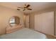 Bright bedroom with mirrored dresser and spacious closet for ample storage at 543 Mayview Nw Ave, Port Charlotte, FL 33952