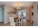 Dining area featuring a dining table and sliding glass doors to the pool area at 543 Mayview Nw Ave, Port Charlotte, FL 33952