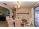 Dining area featuring a dining table and sliding glass doors to the outdoor pool area at 543 Mayview Nw Ave, Port Charlotte, FL 33952