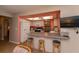 Bright kitchen boasts a breakfast bar with seating and modern appliances at 543 Mayview Nw Ave, Port Charlotte, FL 33952