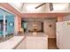 Open kitchen with breakfast bar area has backyard and dining room views at 543 Mayview Nw Ave, Port Charlotte, FL 33952
