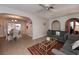 Open concept living room featuring tile floors and access to the dining room at 543 Mayview Nw Ave, Port Charlotte, FL 33952