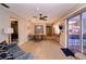 Living room with dining area, kitchen access, and a sliding door to the patio at 543 Mayview Nw Ave, Port Charlotte, FL 33952