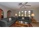 Cozy living room with tile floors, sofas, and a rattan coffee table at 543 Mayview Nw Ave, Port Charlotte, FL 33952