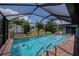 Inviting screened-in pool with brick pavers and well-maintained backyard at 543 Mayview Nw Ave, Port Charlotte, FL 33952