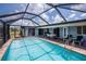 Relaxing screened-in pool area with outdoor seating and a clear view of the sky at 543 Mayview Nw Ave, Port Charlotte, FL 33952