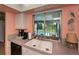 Kitchen sink beneath a window overlooking a screened-in pool area at 543 Mayview Nw Ave, Port Charlotte, FL 33952