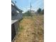 Wide backyard with lawn and a chainlink fence at 635 W Tarpon Nw Blvd, Port Charlotte, FL 33952
