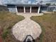 Spacious backyard with a decorative brick walkway leading to the house, perfect for entertaining at 635 W Tarpon Nw Blvd, Port Charlotte, FL 33952