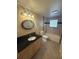 The bathroom features a vanity with a black countertop and tile flooring at 635 W Tarpon Nw Blvd, Port Charlotte, FL 33952
