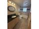 Bathroom featuring a vanity with a black countertop, and tile flooring at 635 W Tarpon Nw Blvd, Port Charlotte, FL 33952