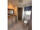 Bright bathroom featuring a granite countertop, ample storage, and tiled walk-in shower at 635 W Tarpon Nw Blvd, Port Charlotte, FL 33952