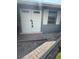 Double doors lead to the front of the house, creating an elegant and welcoming entry at 635 W Tarpon Nw Blvd, Port Charlotte, FL 33952