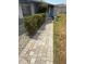 Inviting front yard featuring a brick walkway leading to the house at 635 W Tarpon Nw Blvd, Port Charlotte, FL 33952