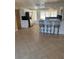 Open concept kitchen with stainless steel appliances, breakfast bar, and tile flooring at 635 W Tarpon Nw Blvd, Port Charlotte, FL 33952