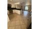 Open kitchen featuring white cabinetry, dark countertops, and stainless steel appliances at 635 W Tarpon Nw Blvd, Port Charlotte, FL 33952