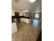 Open kitchen featuring white cabinetry, dark countertops, and stainless steel appliances at 635 W Tarpon Nw Blvd, Port Charlotte, FL 33952
