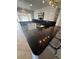 Bright eat-in kitchen featuring white cabinetry, dark countertops, and stainless steel appliances at 635 W Tarpon Nw Blvd, Port Charlotte, FL 33952