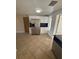 Bright eat-in kitchen featuring white cabinetry, dark countertops, and stainless steel refrigerator at 635 W Tarpon Nw Blvd, Port Charlotte, FL 33952