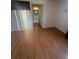 Living room featuring wood-look floors and sliding doors to other rooms at 635 W Tarpon Nw Blvd, Port Charlotte, FL 33952