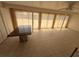 Open-concept living room with tile flooring, ample windows, and natural light at 635 W Tarpon Nw Blvd, Port Charlotte, FL 33952