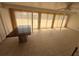 Spacious living room with a granite table and ample natural light from the window at 635 W Tarpon Nw Blvd, Port Charlotte, FL 33952