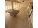 Bright sunroom featuring ceramic tile floors, ceiling fan, and sliding glass windows at 635 W Tarpon Nw Blvd, Port Charlotte, FL 33952