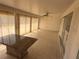 Bright sunroom featuring ceramic tile floors, ceiling fan, and sliding glass windows at 635 W Tarpon Nw Blvd, Port Charlotte, FL 33952