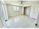 Bright bedroom with a closet, a ceiling fan, and polished floors at 700 Dolphin Pkwy, Punta Gorda, FL 33950