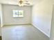 Bedroom featuring a ceiling fan and natural light from the window at 700 Dolphin Pkwy, Punta Gorda, FL 33950