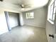 Bedroom featuring neutral colors, terrazzo flooring, ceiling fan and closet at 700 Dolphin Pkwy, Punta Gorda, FL 33950