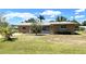 Charming single-story home with well-maintained lawn and mature landscaping at 700 Dolphin Pkwy, Punta Gorda, FL 33950