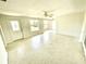 Well-lit living room with terrazzo floors and a front-door view at 700 Dolphin Pkwy, Punta Gorda, FL 33950
